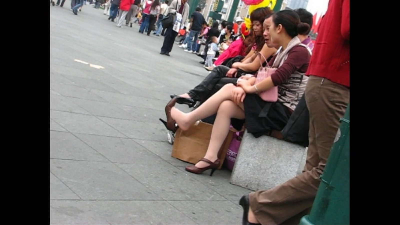 Women&#039;s shoes brown heels sitting with legs dangling